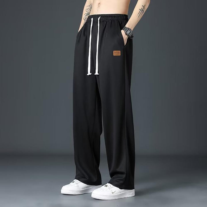 Men Loose Fit Pleated Mid-Rise Regular Trousers
