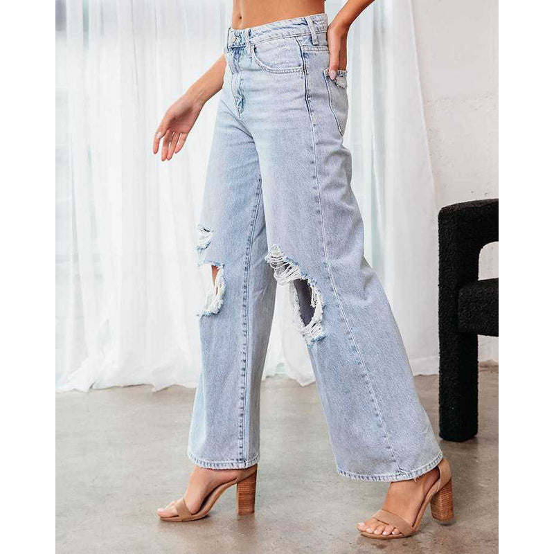 Women Blue Bootcut Highly Distressed Mid-Rise Stretchable Jeans