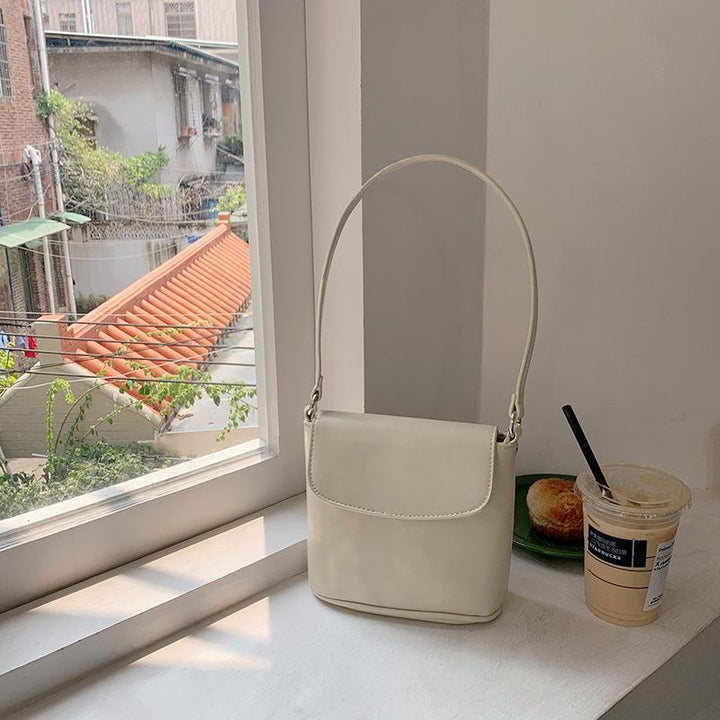 Off White Solid One Handle Sling Bag