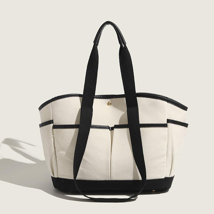 Women Solid Structured Handheld Bag