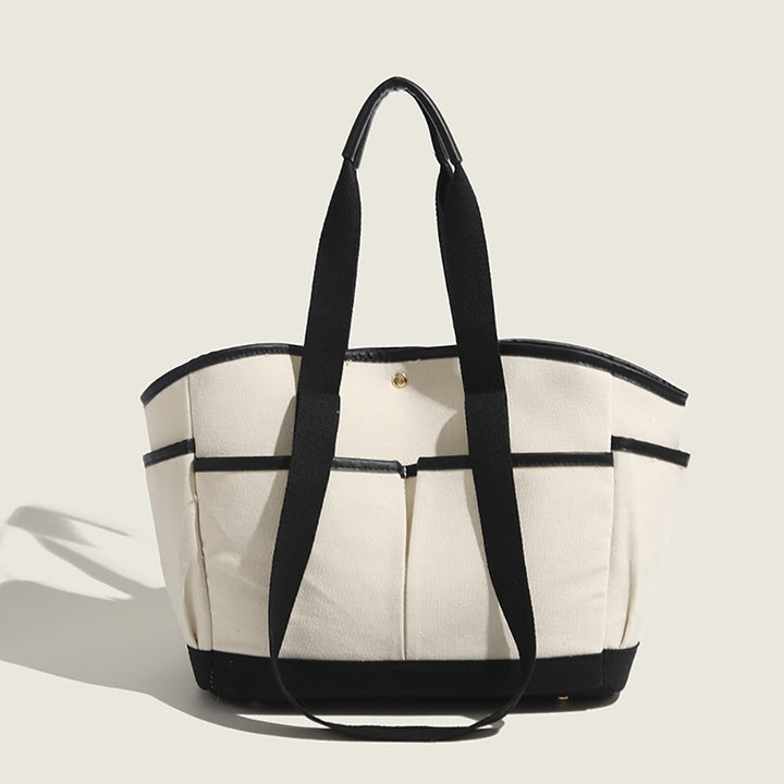 Women Solid Structured Handheld Bag