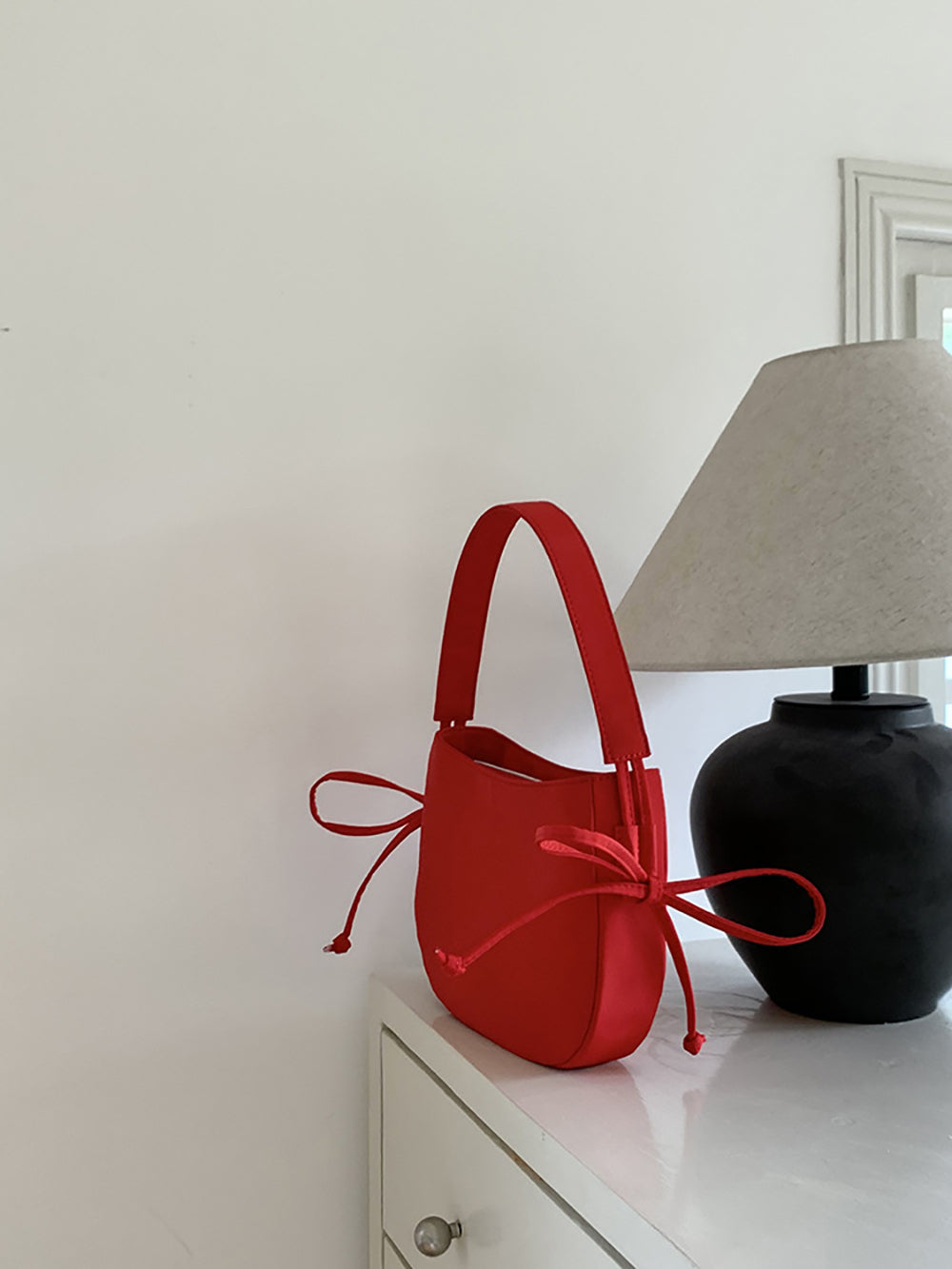 Women Solid Structured Handheld Bag