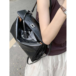 Women Solid Structured Handheld Bag