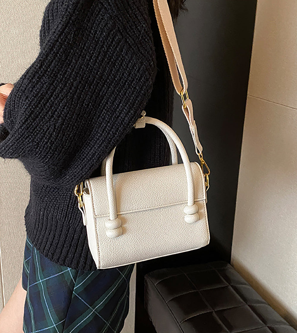 Women Solid Structured Handheld Bag