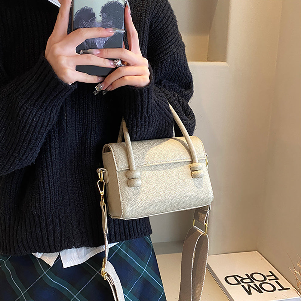 Women Solid Structured Handheld Bag